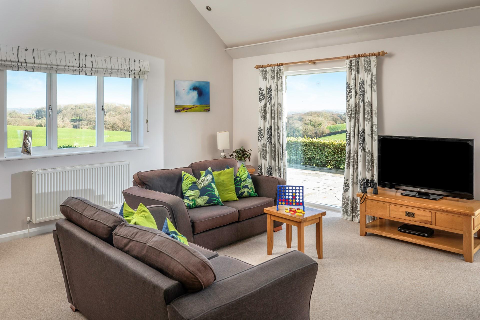 Relax on the sofas enjoying the countryside views.