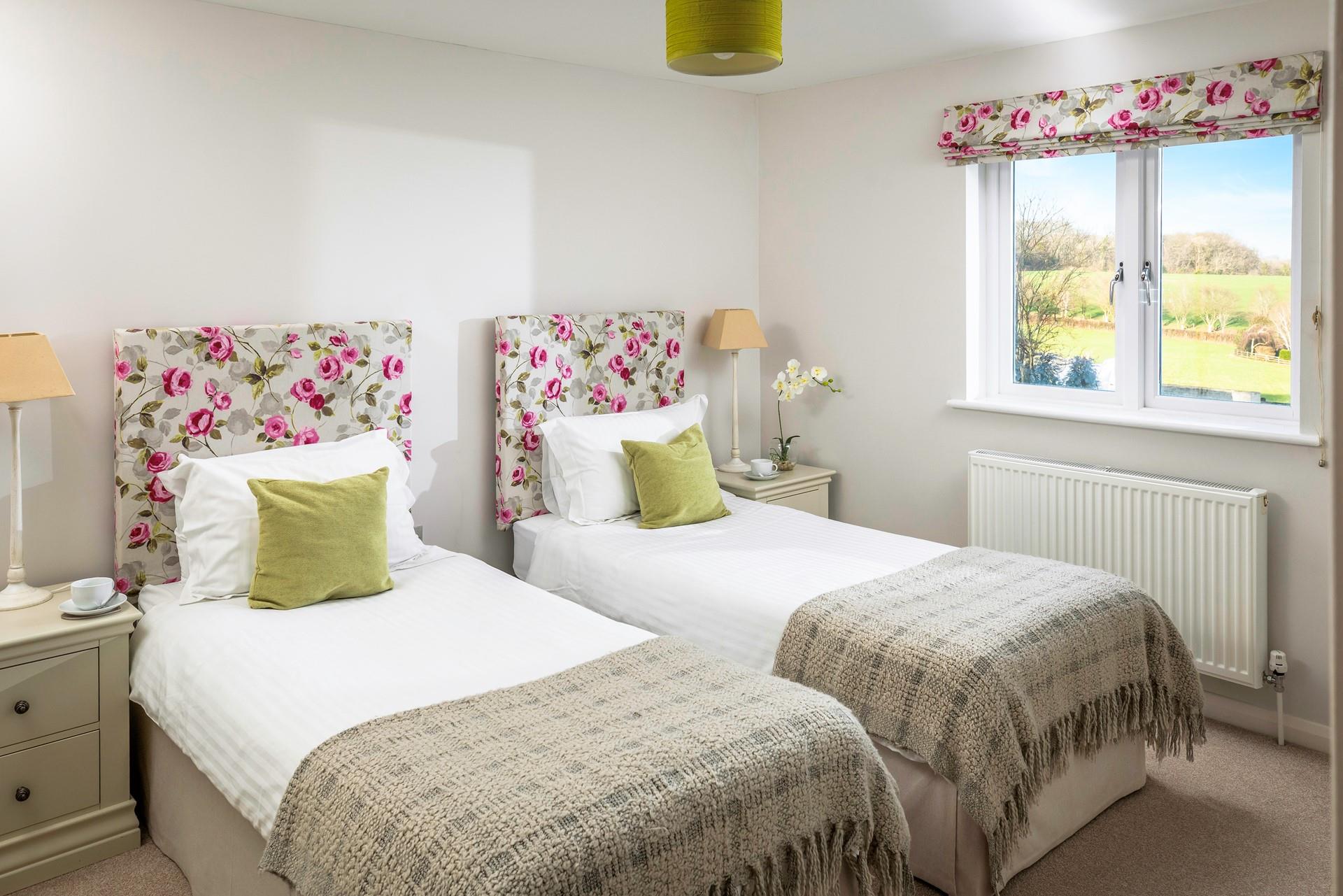 The twin bedroom is ideal for a peaceful night's sleep.