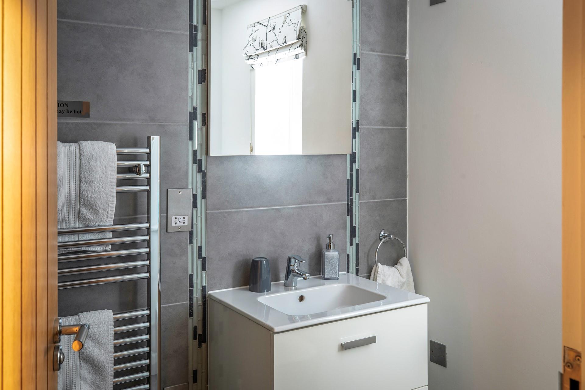 Get ready for the day in the en suite.