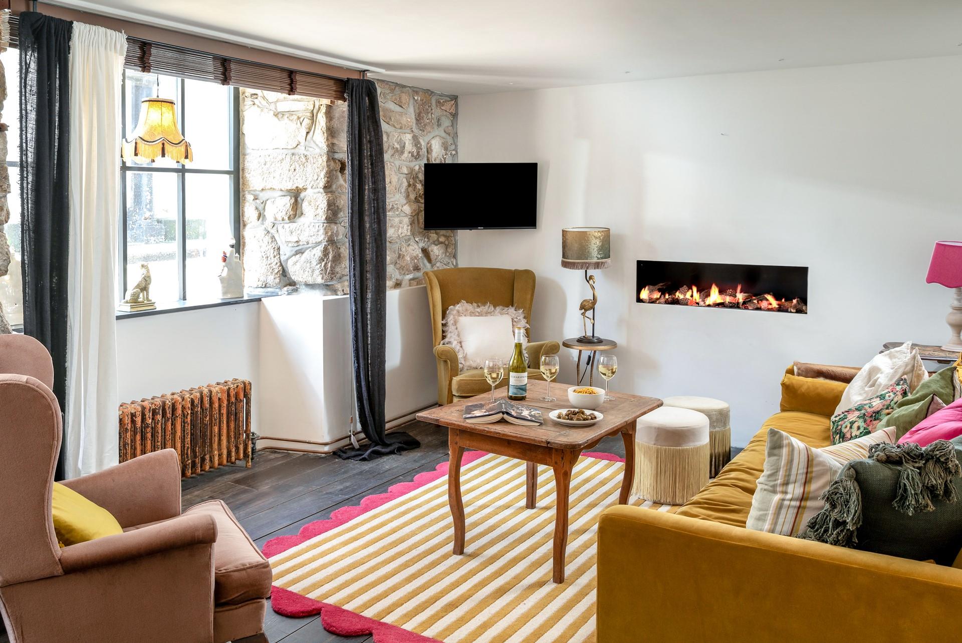 Relax and unwind in the beautiful sitting room.