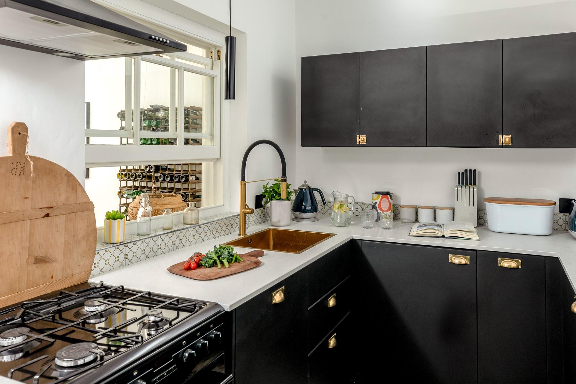 The kitchen offers a modern space to cook up a storm.