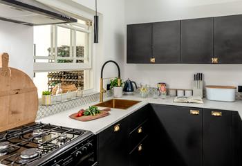 The kitchen offers a modern space to cook up a storm.