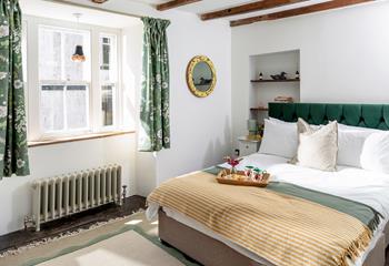 Bedroom 1 has a king size bed, a cosy base to rest your head each night.
