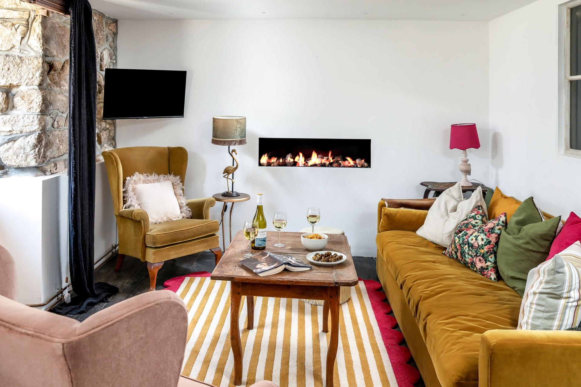 Quirky and colourful furniture fills the sitting room.