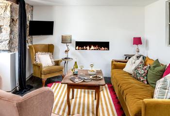 Quirky and colourful furniture fills the sitting room.