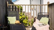 Sunloungers on the raised and terraced decking area are the perfect sunbathing spot.