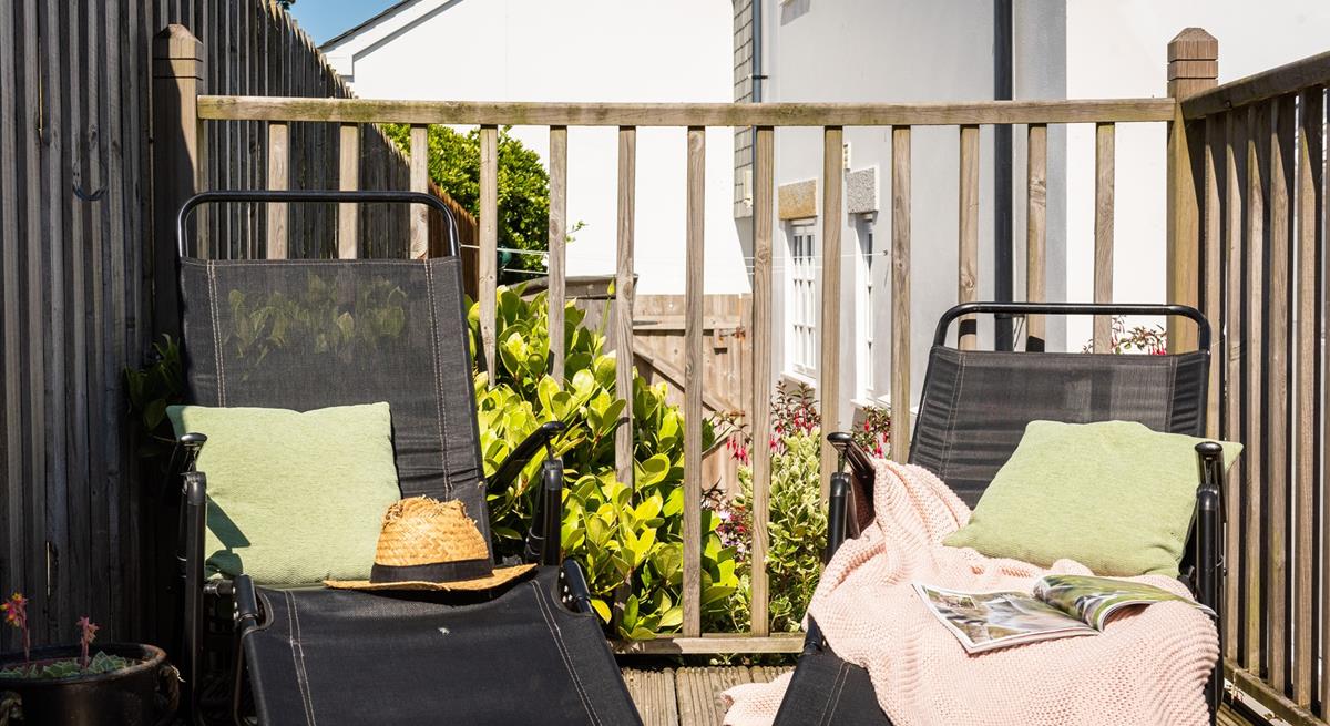 Sunloungers on the raised and terraced decking area are the perfect sunbathing spot.