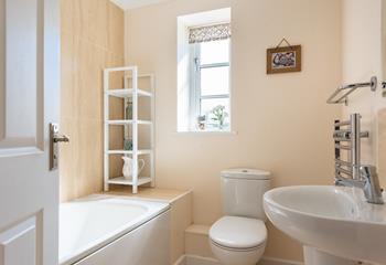 The family bathroom has a bath for relaxing evenings.