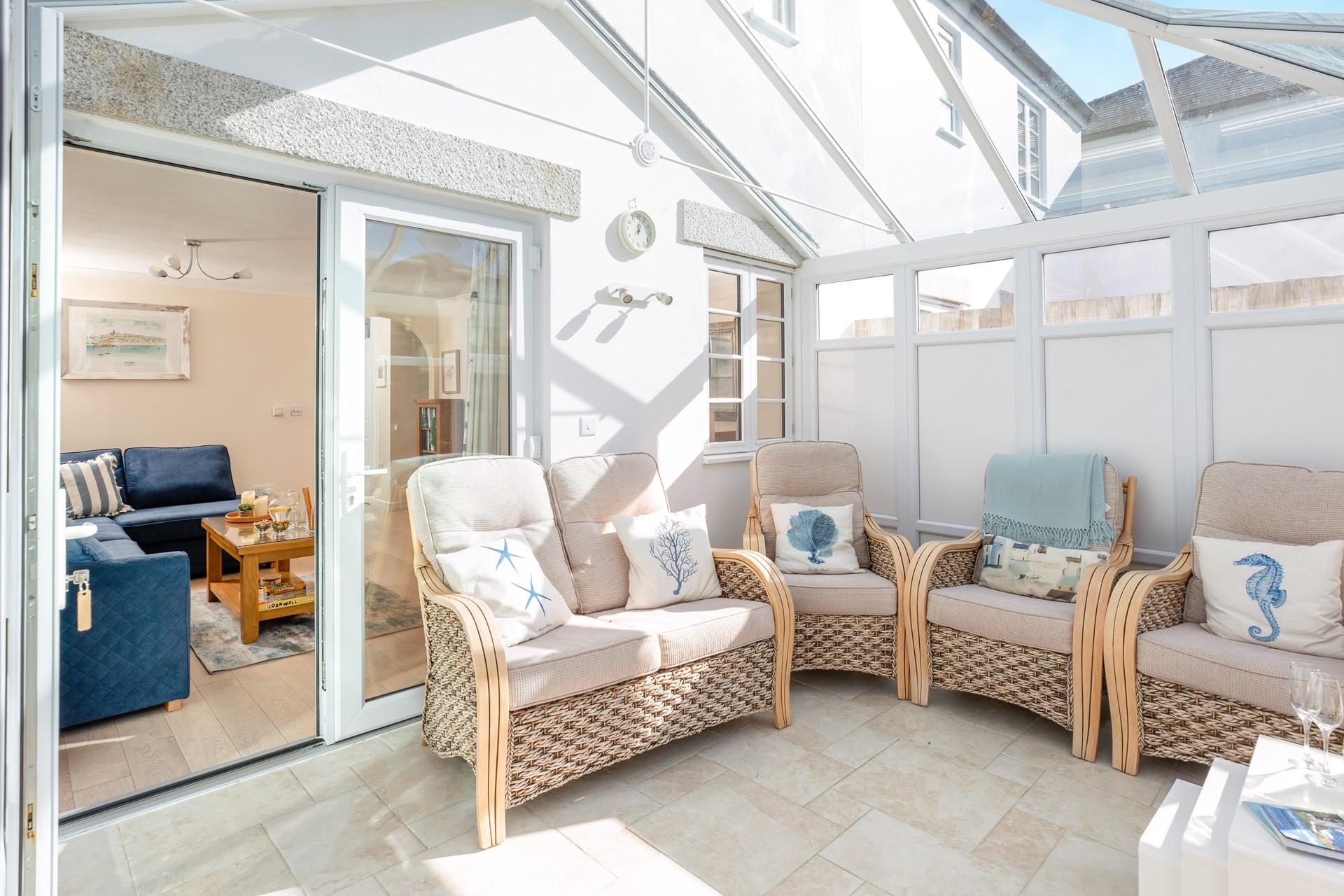 The conservatory is perfect for long lazy afternoons spent unwinding with the summer breeze running through.
