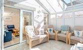 The conservatory is perfect for long lazy afternoons spent unwinding with the summer breeze running through. - Thumbnail Image