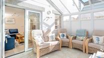 The conservatory is perfect for long lazy afternoons spent unwinding with the summer breeze running through.