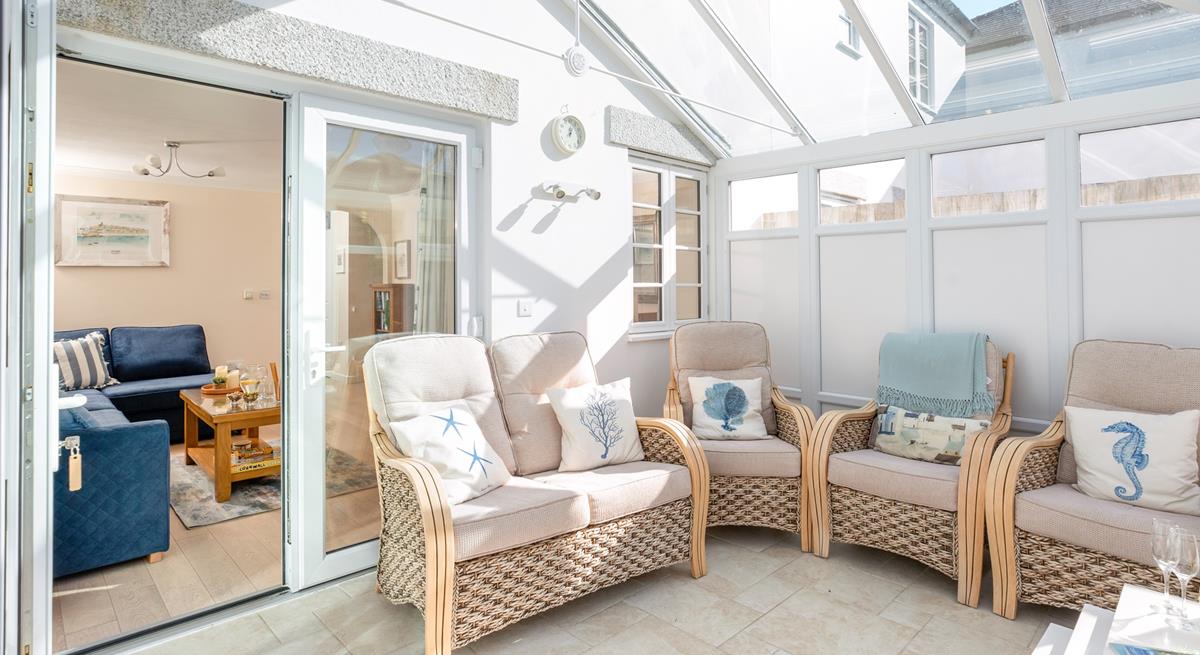 The conservatory is perfect for long lazy afternoons spent unwinding with the summer breeze running through.