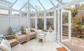 Relax in the conservatory after a day on the beach. - Thumbnail Image