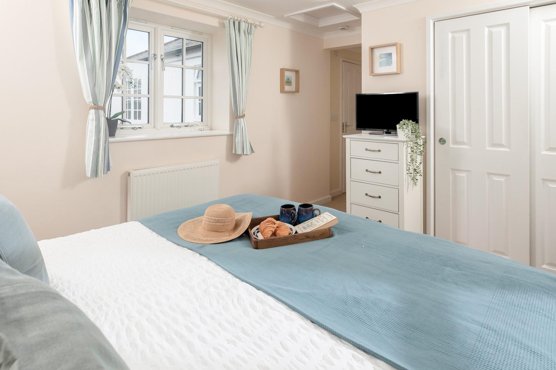 Calming blues create a serene bedroom where you'll sleep soundly!