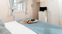 Calming blues create a serene bedroom where you'll sleep soundly!