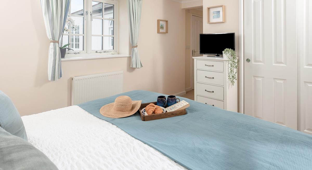 Calming blues create a serene bedroom where you'll sleep soundly!