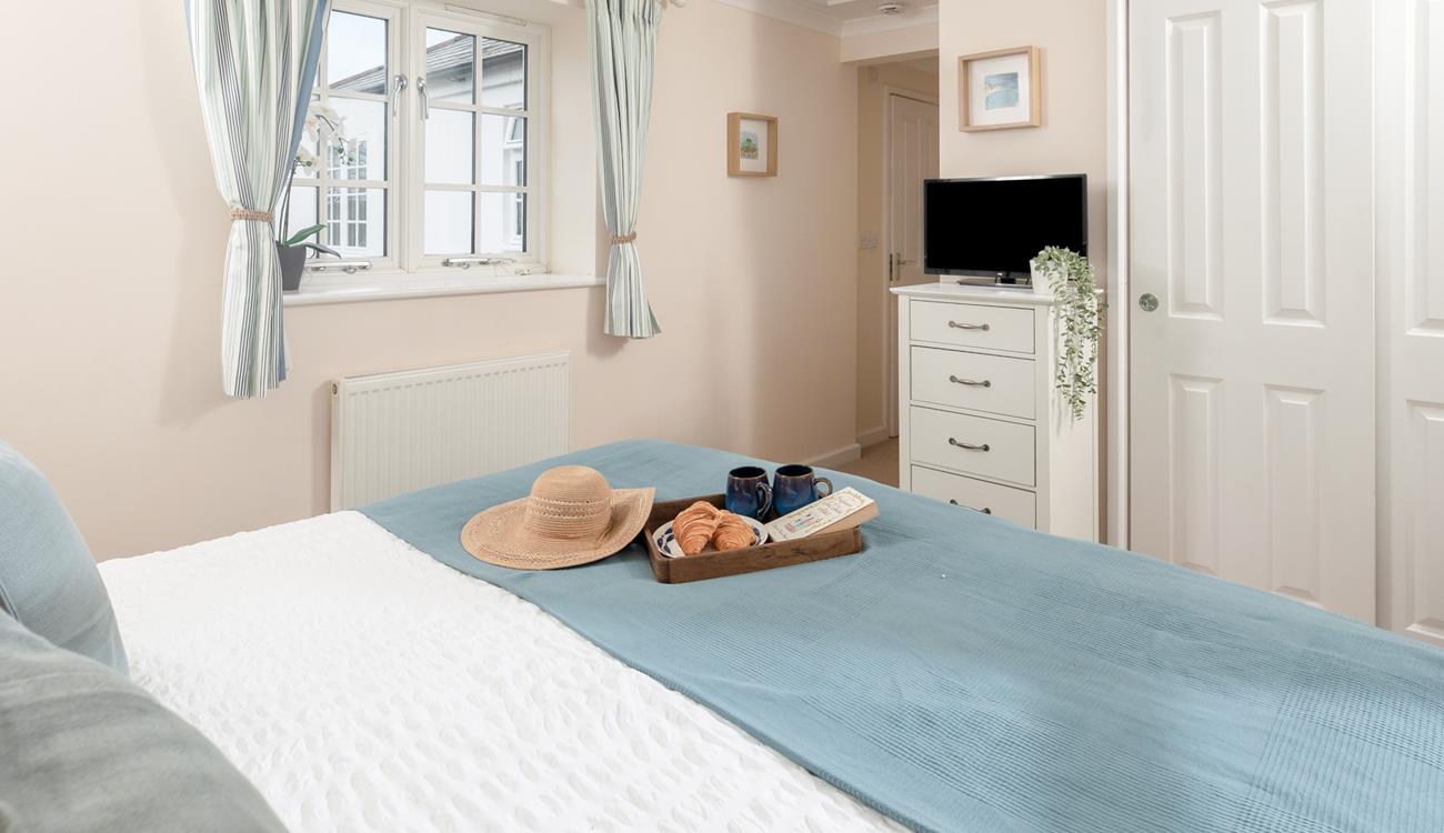 Calming blues create a serene bedroom where you'll sleep soundly!