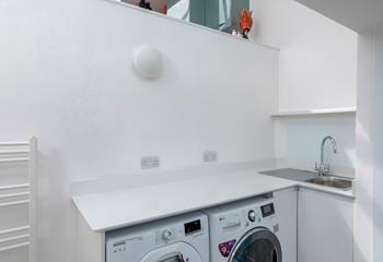 The utility area is equipped with a washer and dryer.