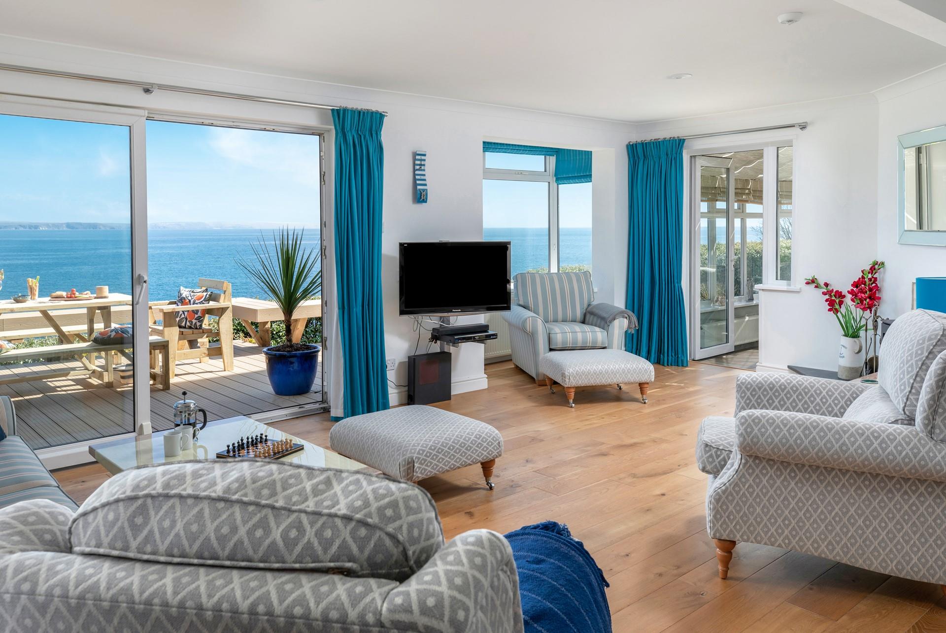 The light and comfortable sitting room is ideal for watching the sea vistas.