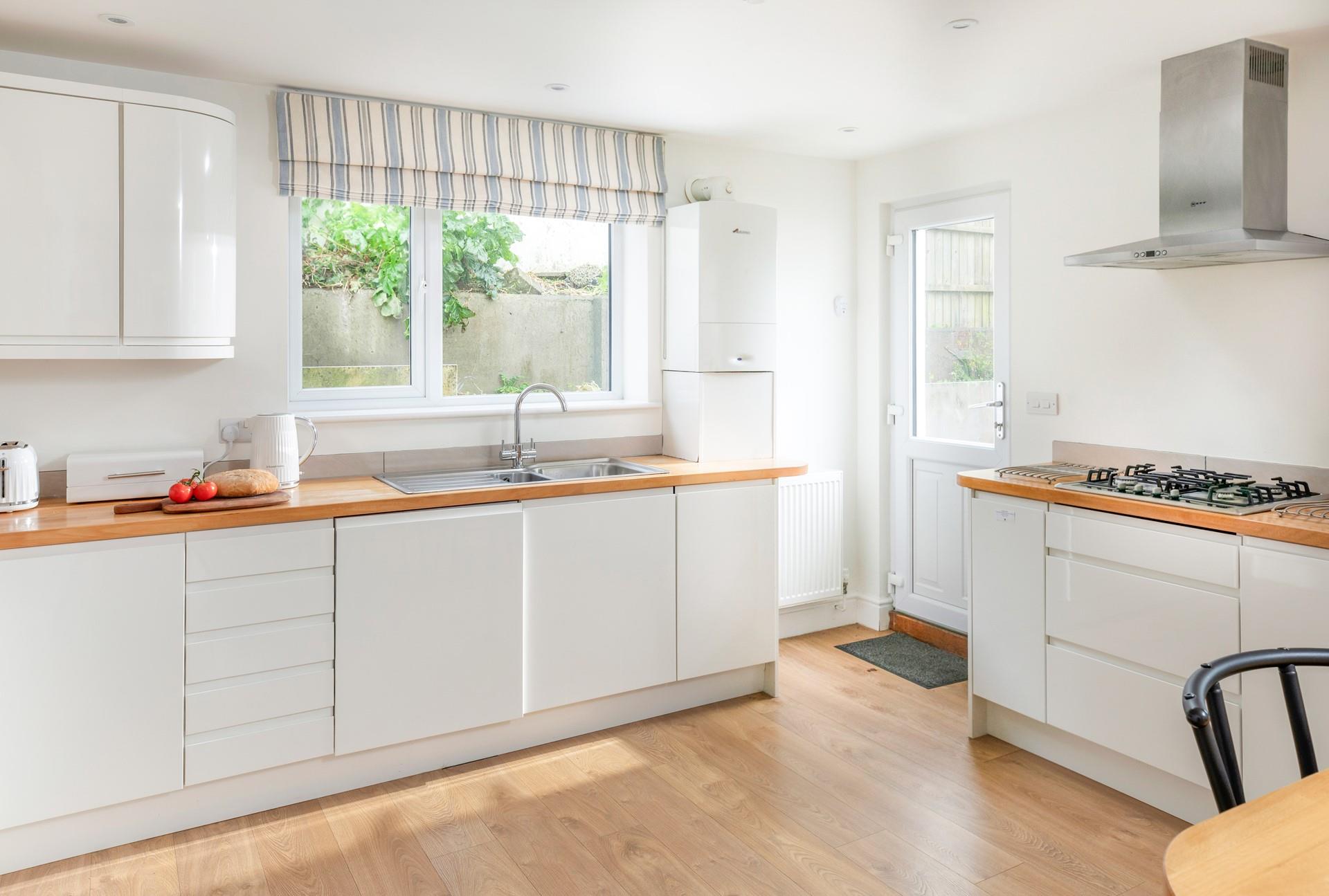 The kitchen is modern and spacious.