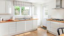 The kitchen is modern and spacious.