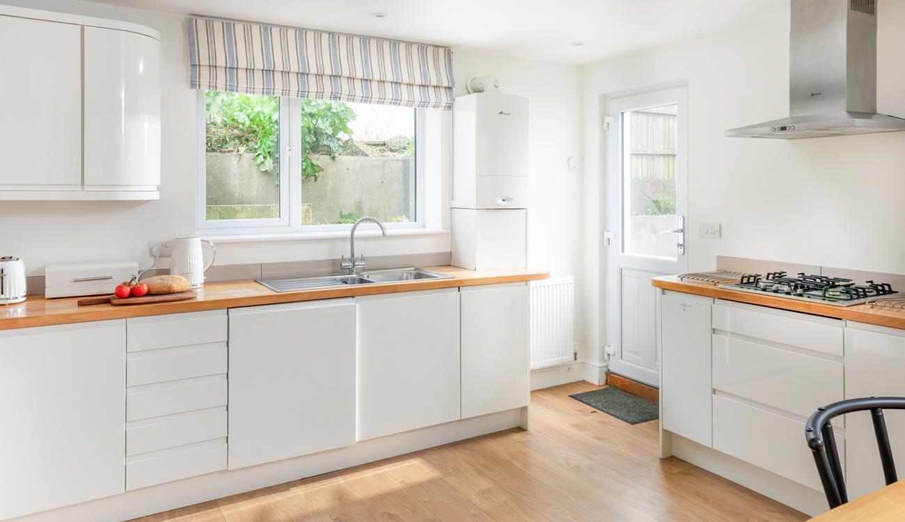 The kitchen is modern and spacious.