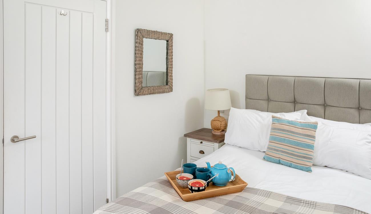 Reflect on the day as you unwind in the comfortable bed.