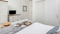The bedroom has a handy en suite.