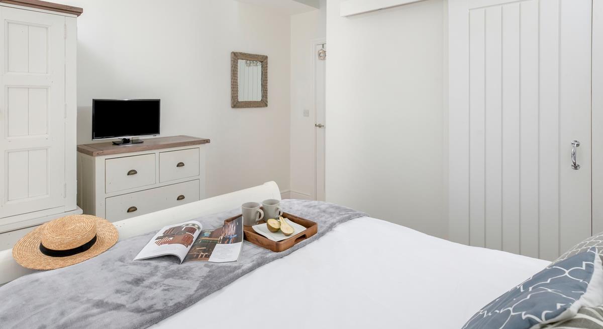 The bedroom has a handy en suite.