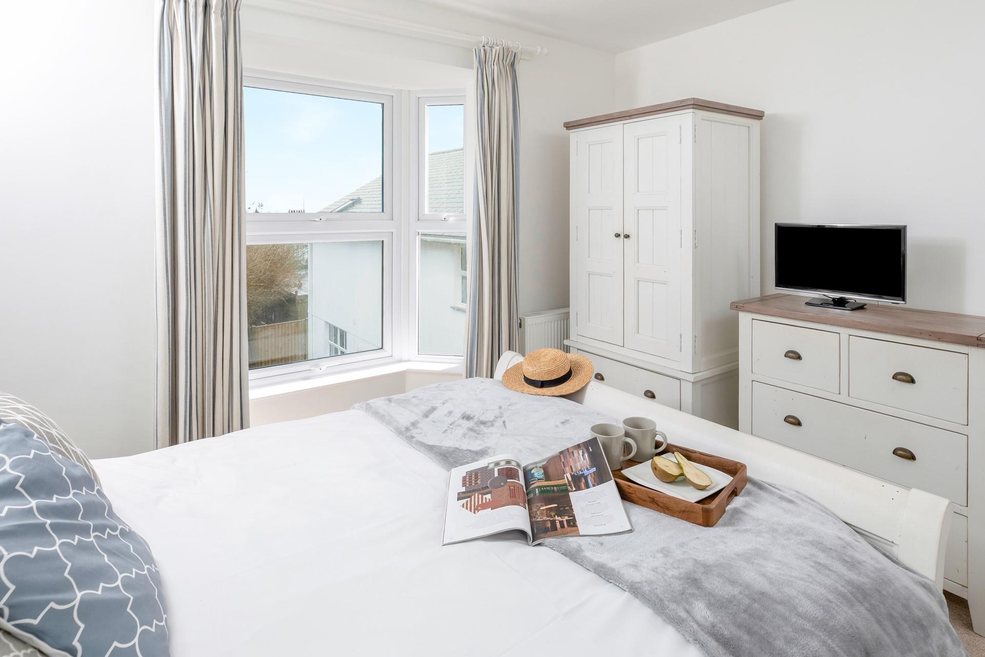 Sip a cuppa in bed and decide on the day's plans.