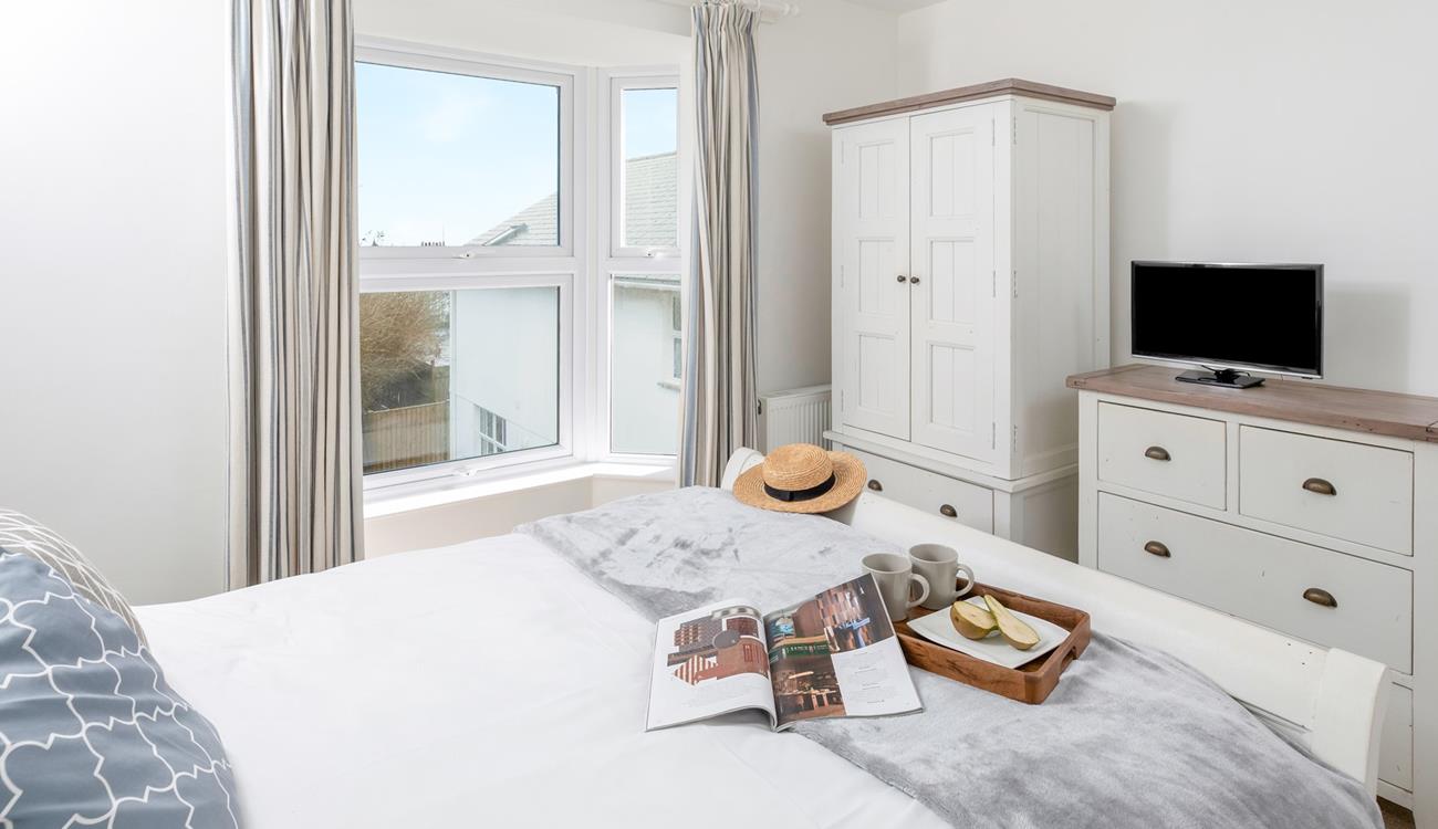 Sip a cuppa in bed and decide on the day's plans.