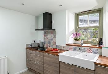 The kitchen looks out into the lush sub-tropical gardens.
