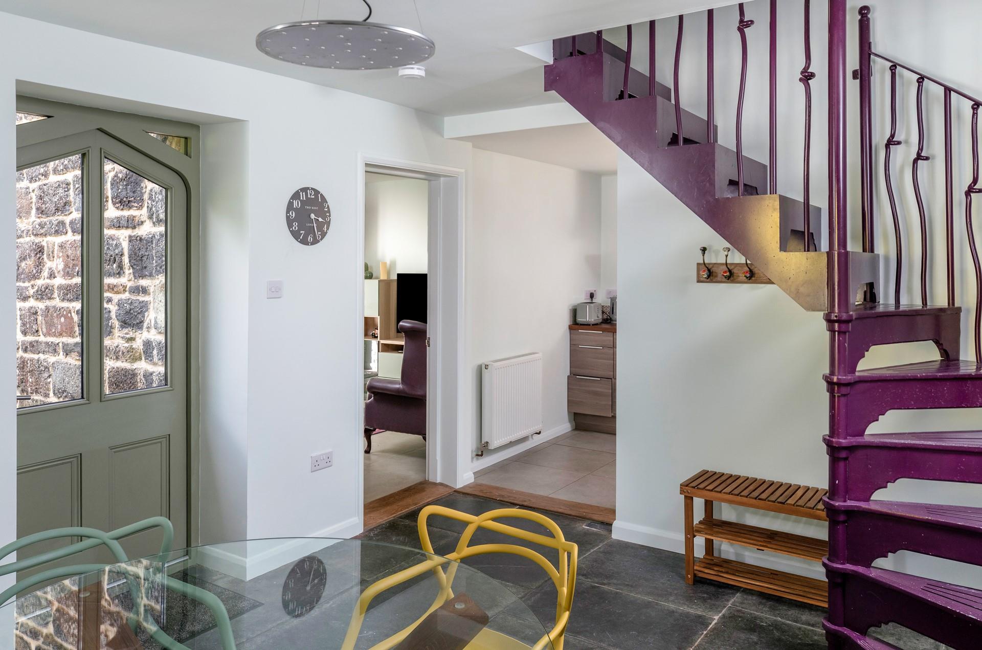 Step from the dining room into the lounge and kitchen.