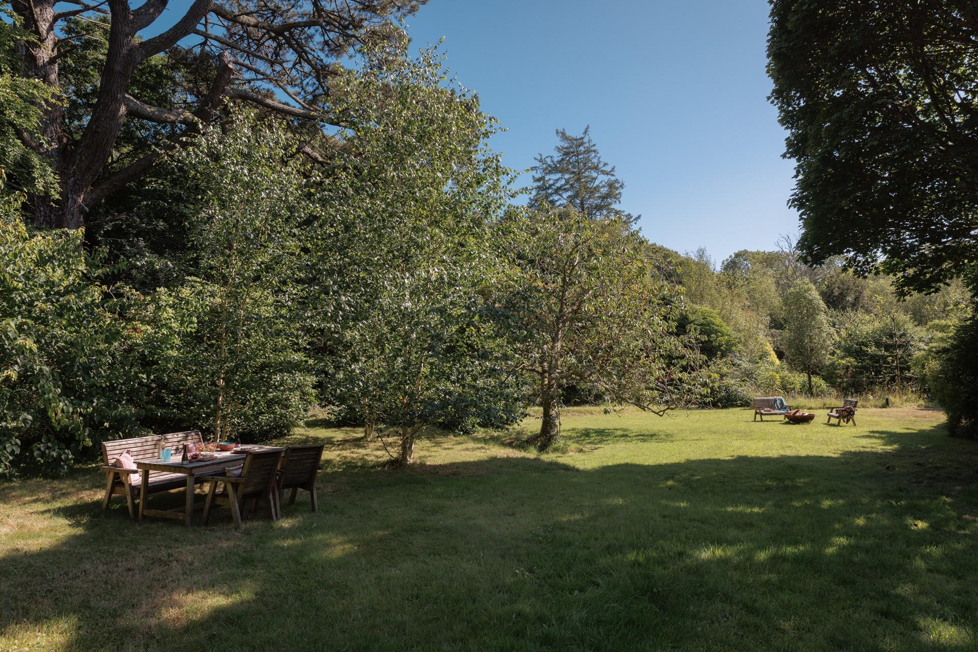 Wander through the leafy garden in the sunshine.