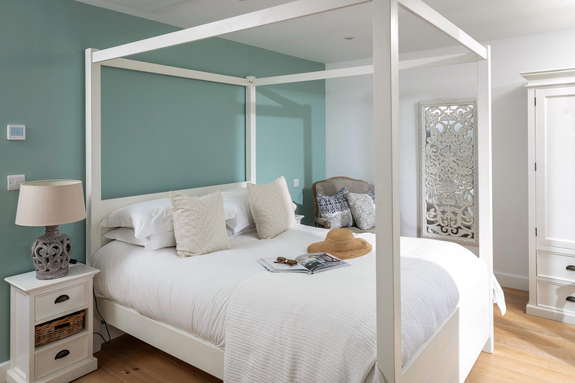 Sink into a relaxing night's slumber in the four-poster bed.