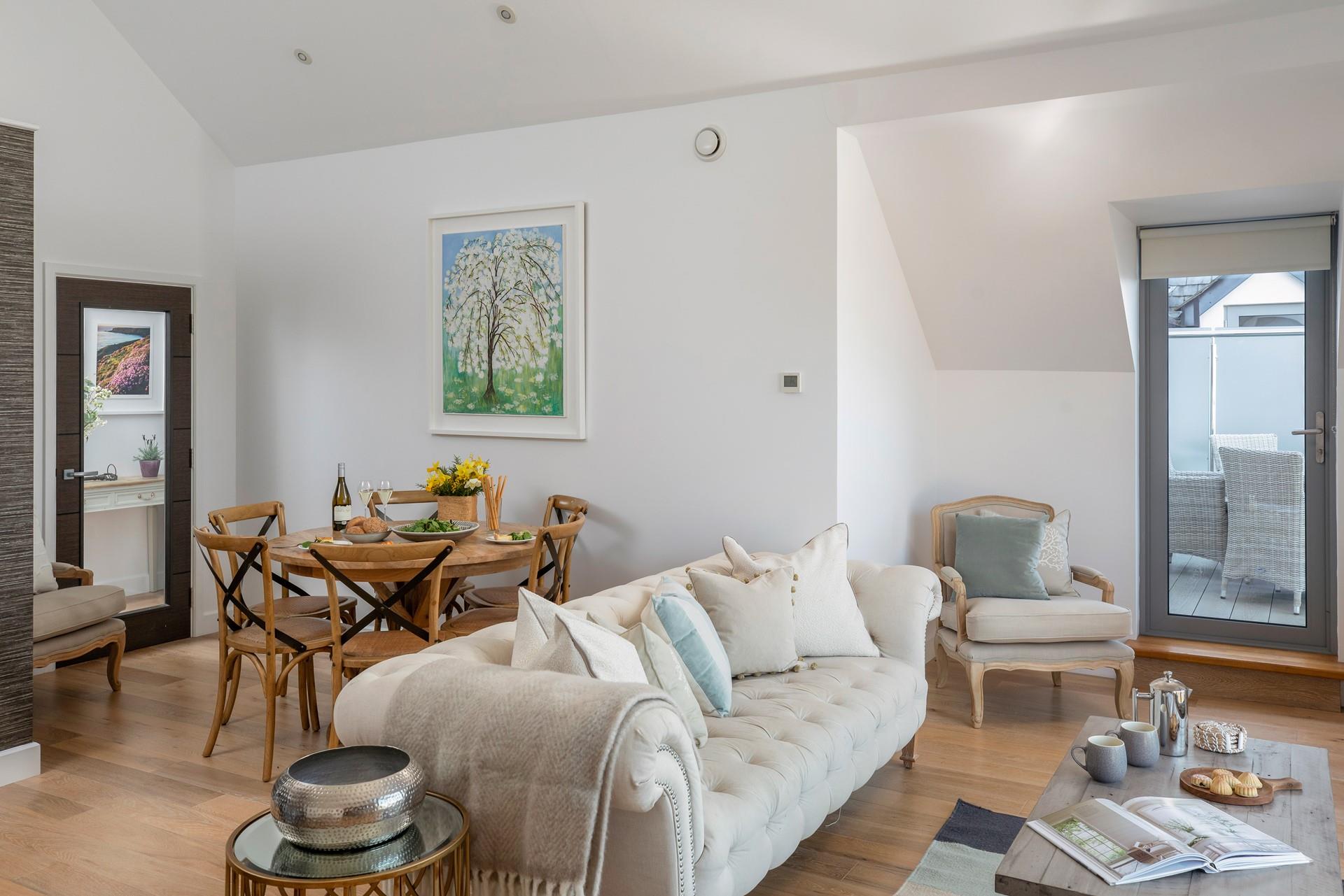 The open plan living space is bright and tastefully decorated.