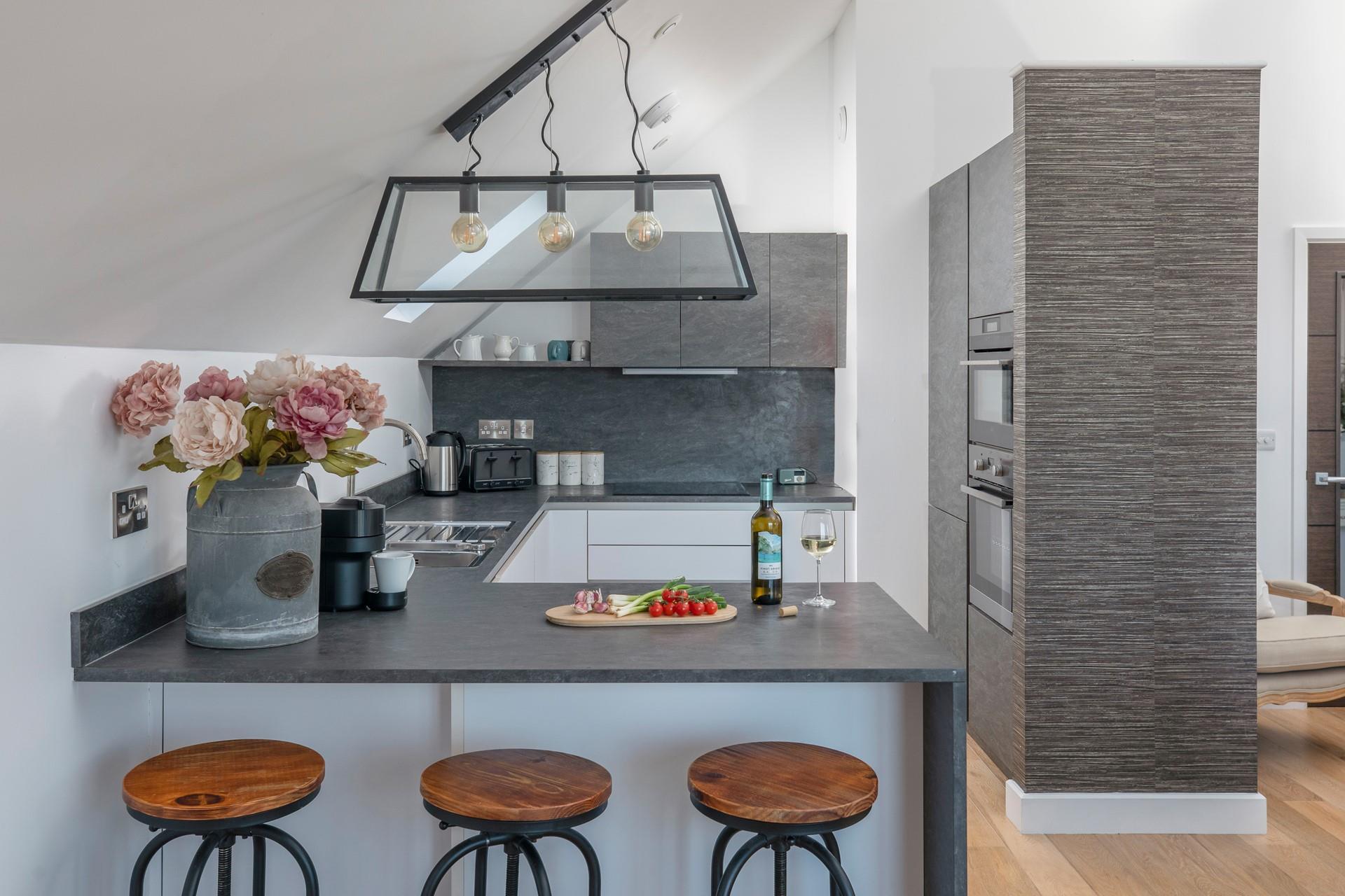 The kitchen is modern and stylish.