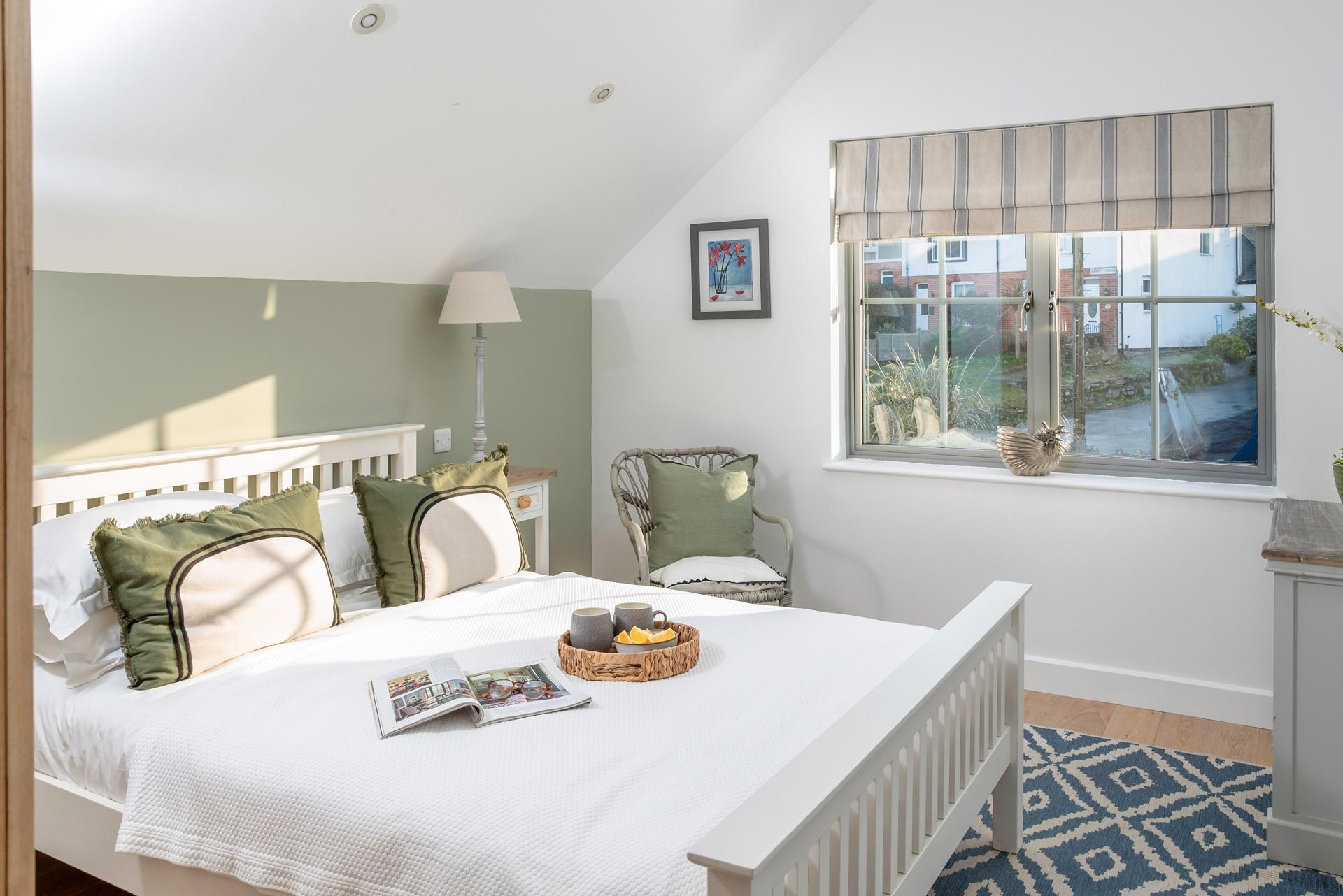 Calming greens feature in bedroom 3.