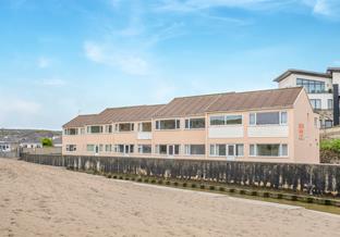Sand Bay apartments are ideally located right on the beach.