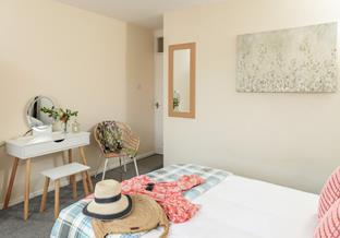 Get ready at the dressing table and head out to explore Perranporth.