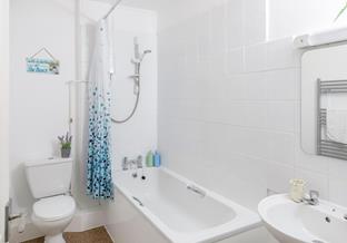 Wash off sandy toes in the shower.