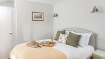The bedrooms are decorated with tasteful soft furnishings.