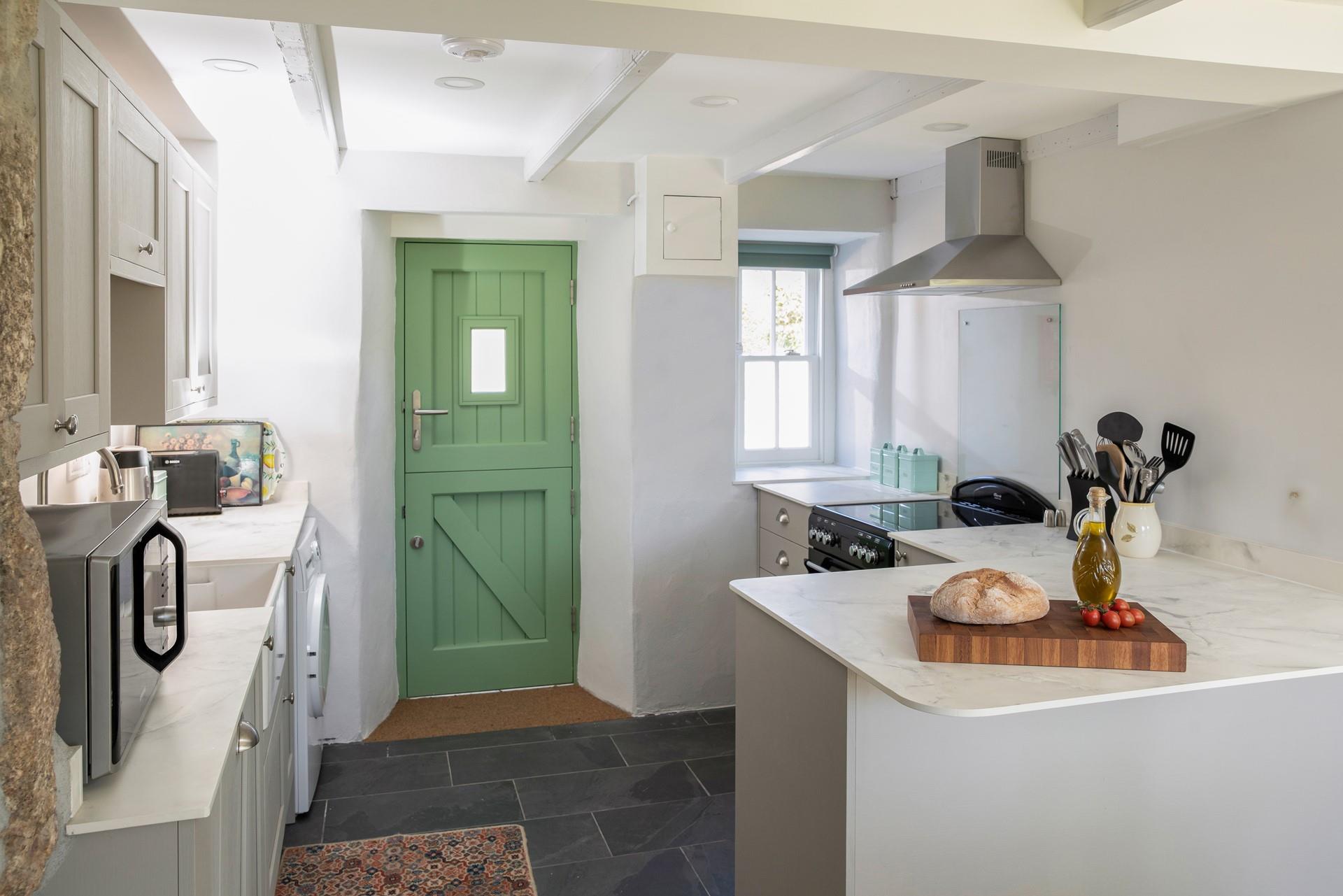 The kitchen is modern with plenty of worktop space.