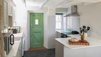 The kitchen is modern with plenty of worktop space.