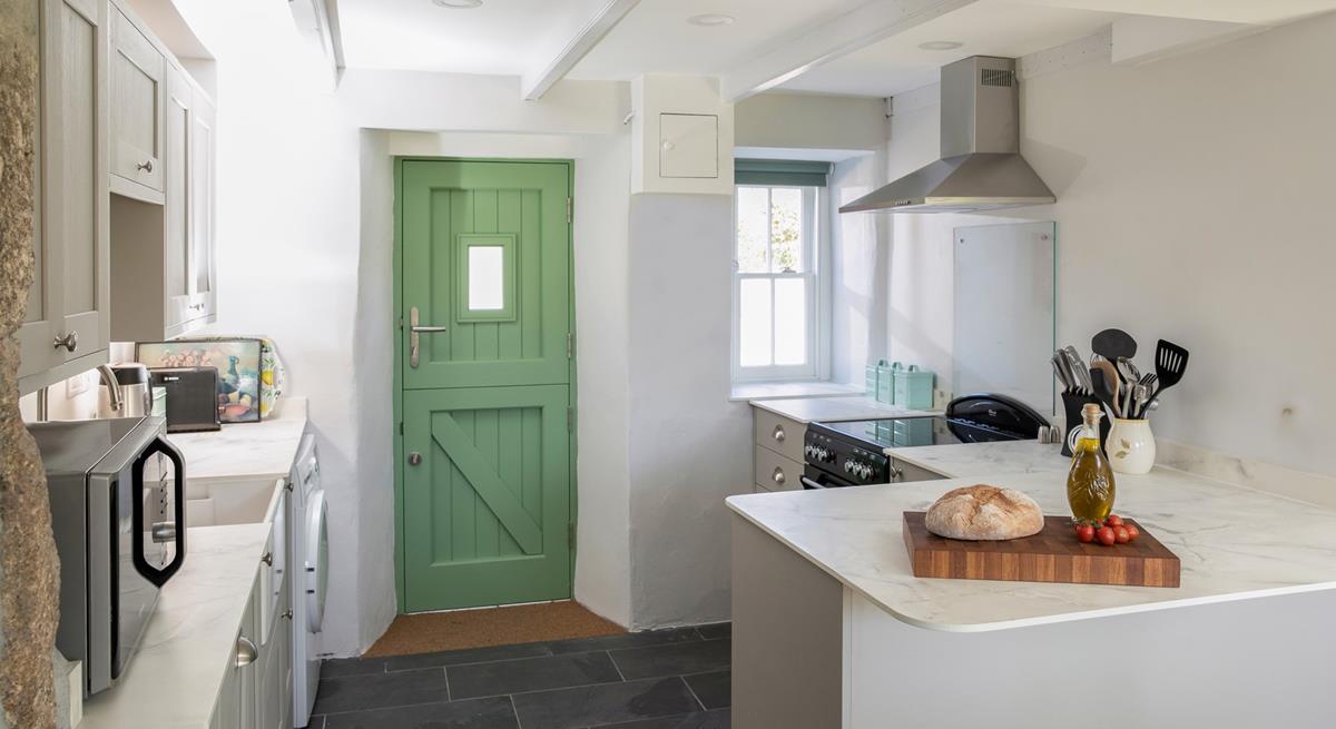 The kitchen is modern with plenty of worktop space.