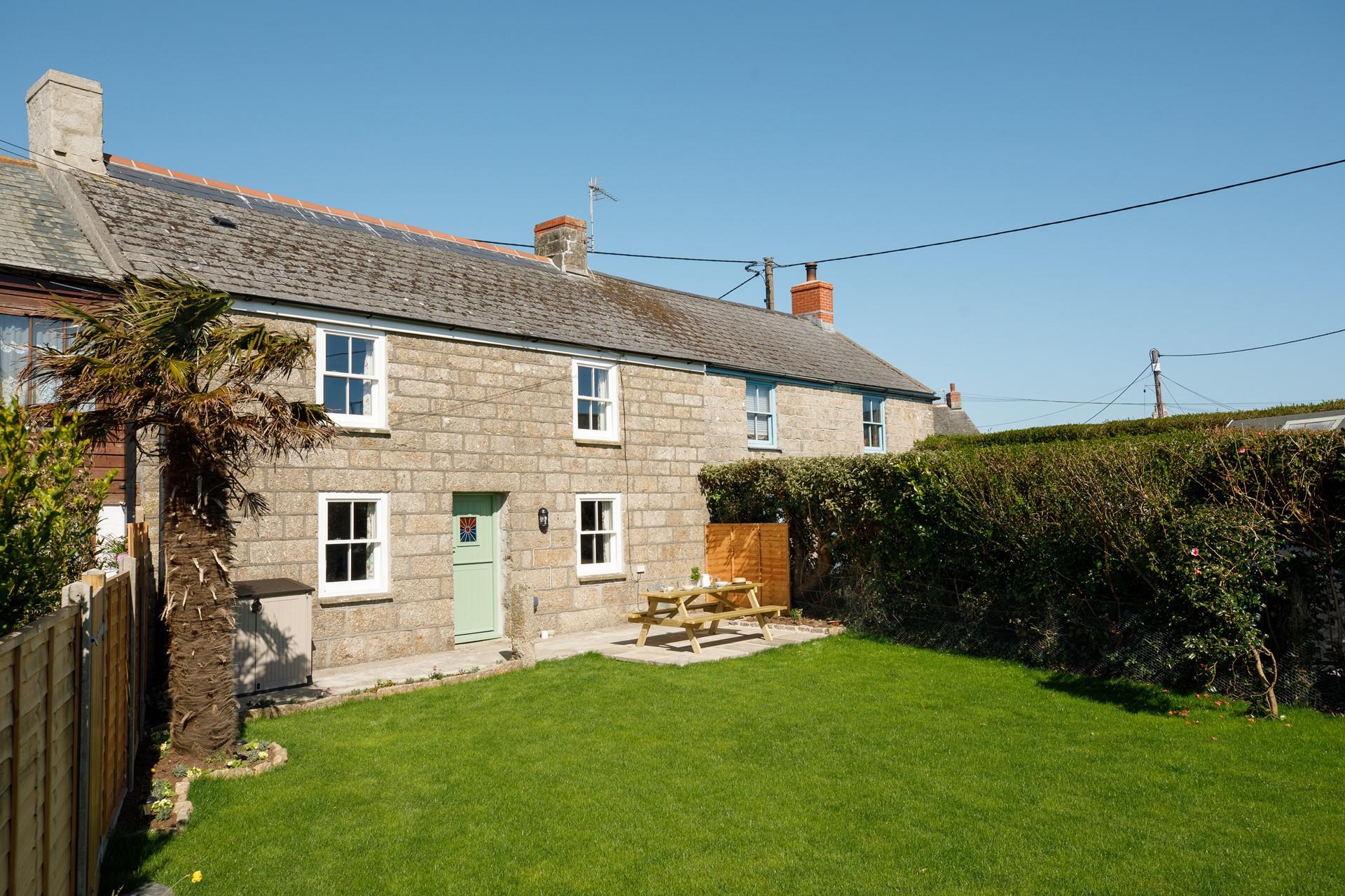 The large garden is ideal for soaking up the sunshine.