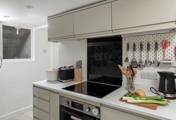The kitchen is modern and well-equipped.