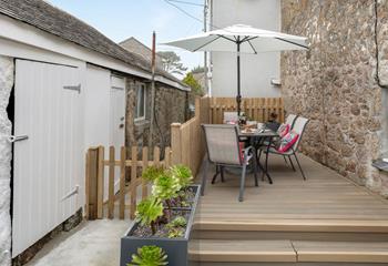 Relax on the decking in the summer sunshine.