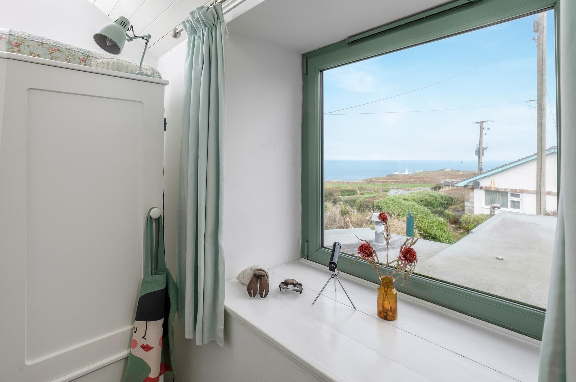 Bedroom 2 offers beautiful sea views.