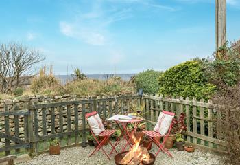 As the sun sets, gather around the fire pit for the evening.